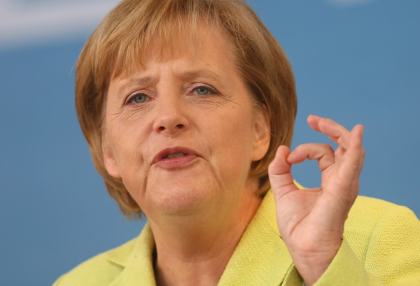 Angela Merkel gets beer from the waiter